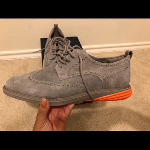 Men’s gray zero grand Cole Haan with orange sole